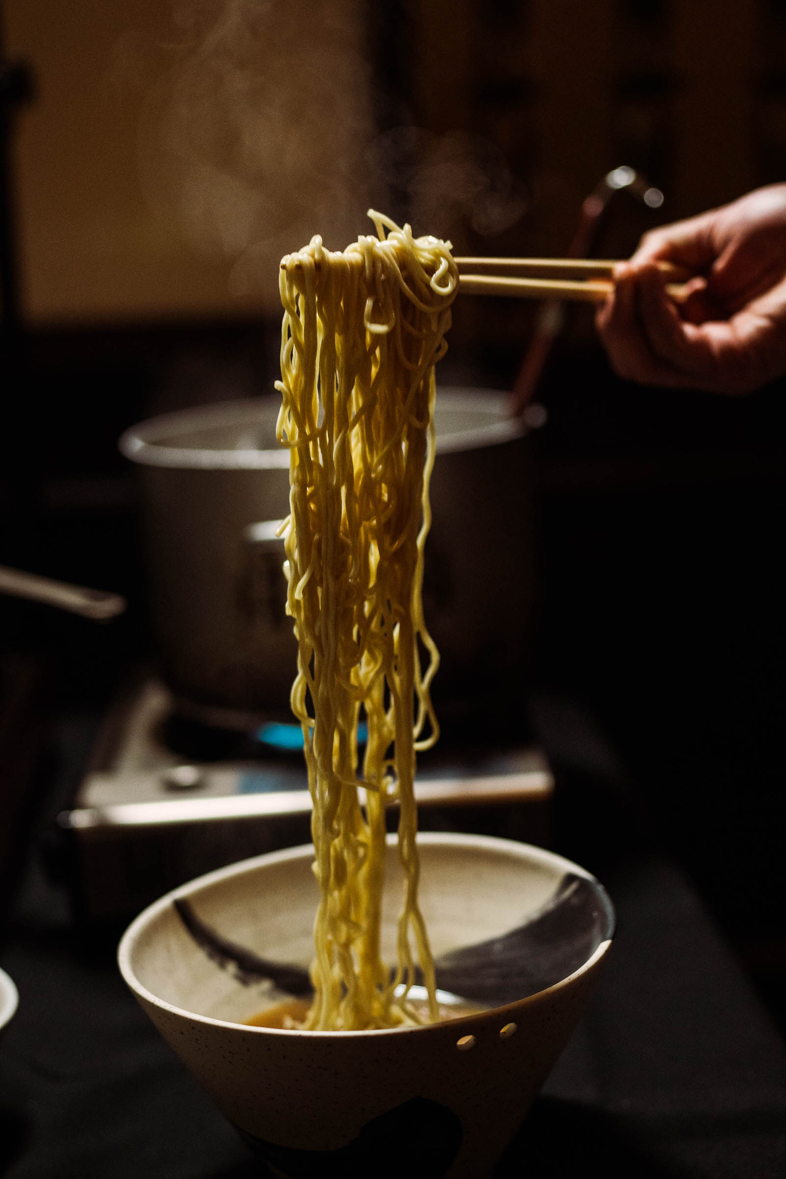 Workshop students crafting noodles